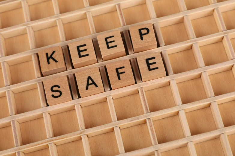 a pile of wooden blocks with the words keep safe written on them, a picture, by Joseph Severn, shutterstock, grid of styles, kami, bl, emergency countermeasures