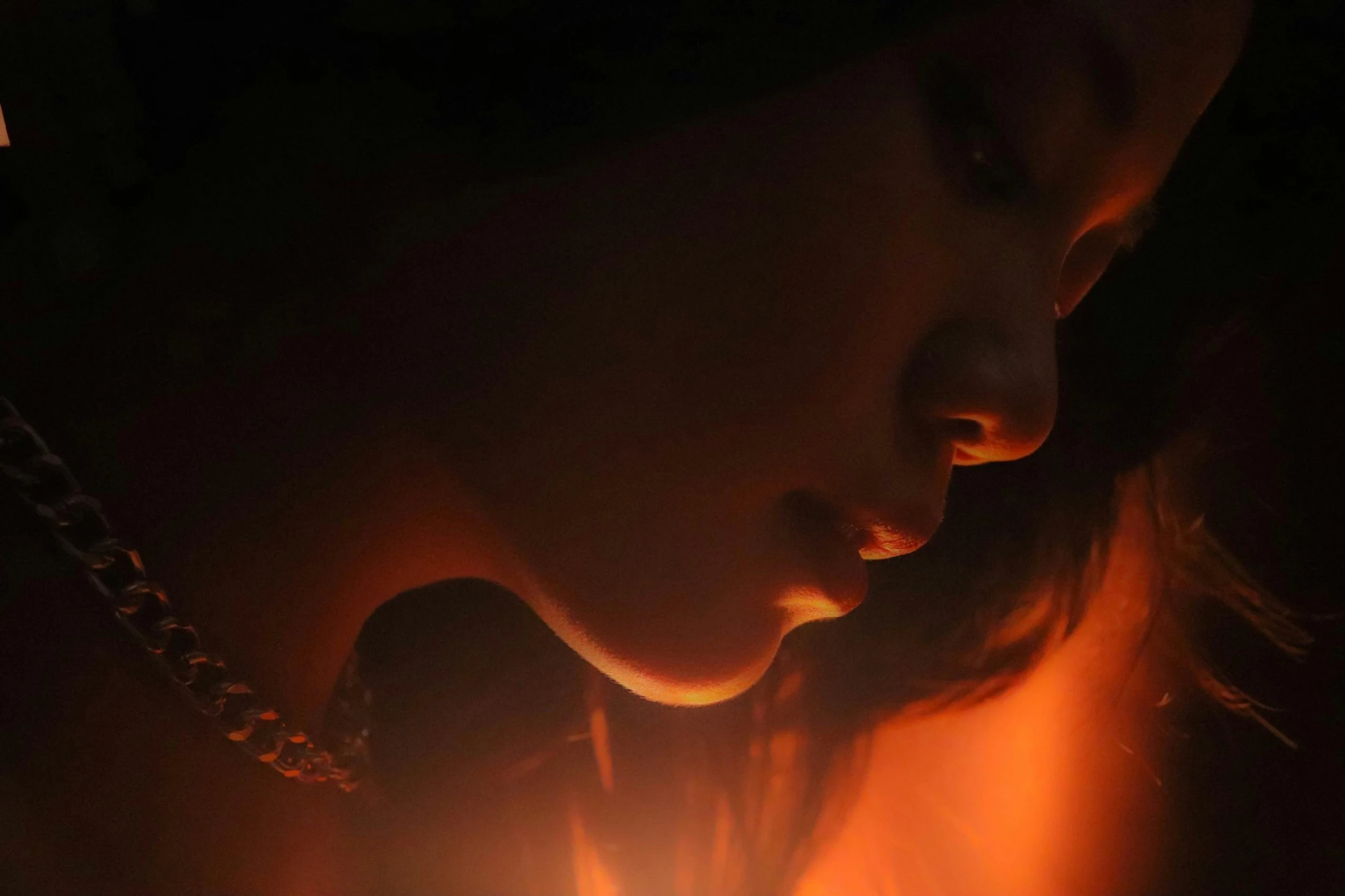 a close up of a person holding a cell phone, pexels contest winner, hyperrealism, fireball lighting her face, woman's profile, japonisme 3 d 8 k ultra detailed, orange light