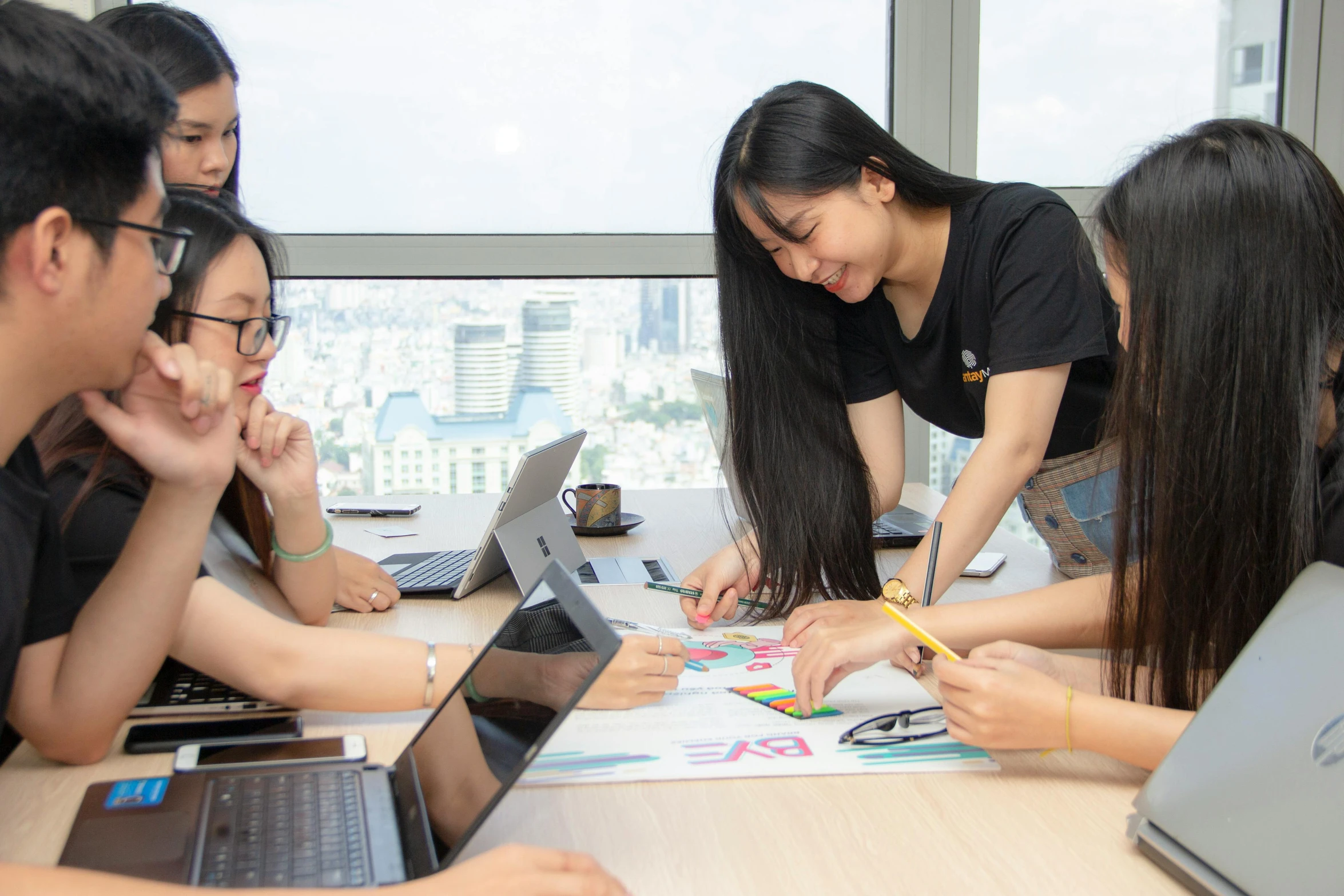 a group of people sitting around a table with laptops, a picture, by Jang Seung-eop, pexels contest winner, teaching, background image, asian female, hoang long ly