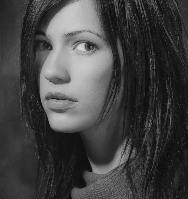 a black and white photo of a woman with long hair, by Maurycy Gottlieb, 2 0 0 6 advertising promo shot, black hair and brown eyes, headshot profile picture, young woman in her 20s