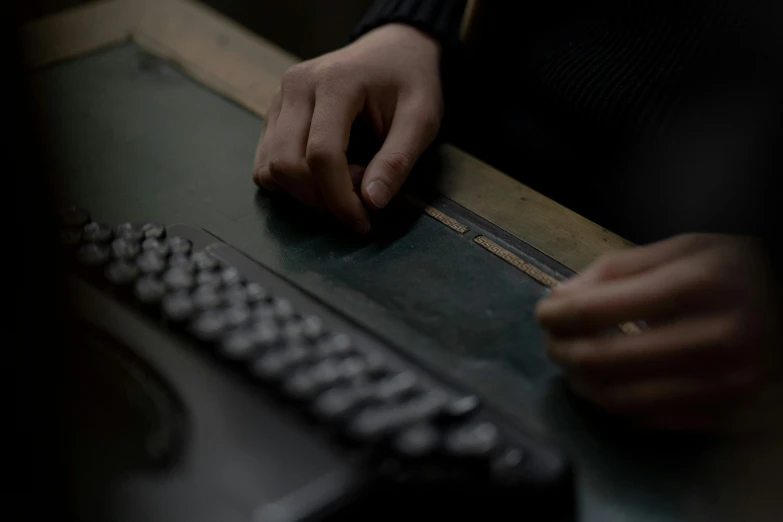 a close up of a person typing on a keyboard, by Elsa Bleda, costumes from peaky blinders, in a workshop, ignant, bureau of engraving and printing