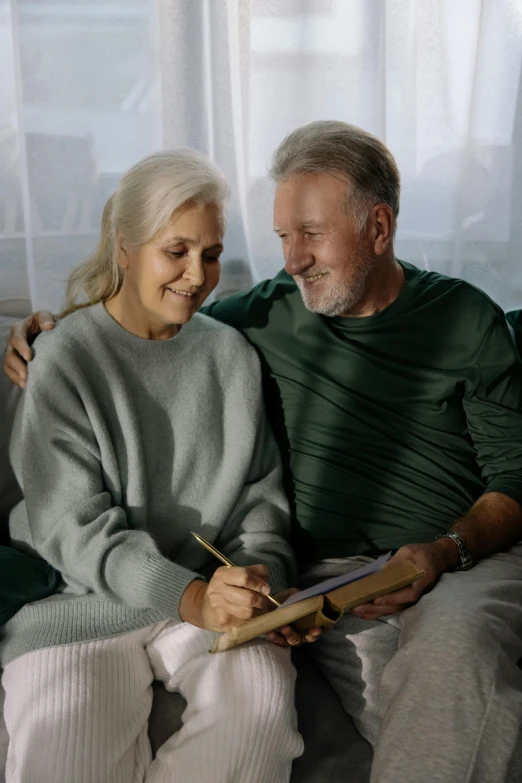 a man and a woman sitting on a couch, gray haired, paul barson, maintenance, trending photo