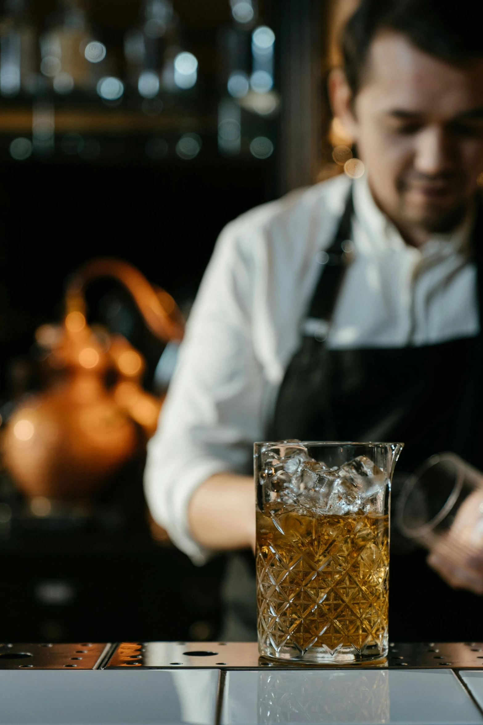 a bartender preparing a drink at a bar, a portrait, trending on unsplash, renaissance, tall iced tea glass, thumbnail, manuka, multiple stories