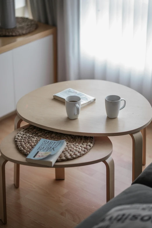 a wood coffee table sitting on top of a wooden floor