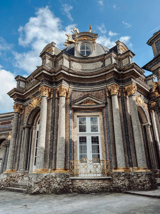 a large building with a clock on top of it, inspired by Stanislas Lépine, baroque, black marble and gold, inside a castle courtyard, slide show, colonnade