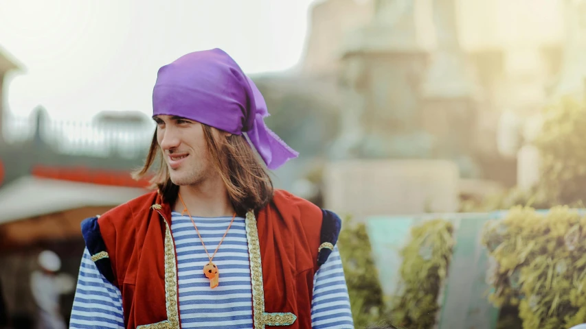 a man wearing a purple hat and a blue and white striped shirt, a colorized photo, by Julia Pishtar, trending on pexels, renaissance, ( pirate with a bandanna ), wearing, aladdin, cosplay photo