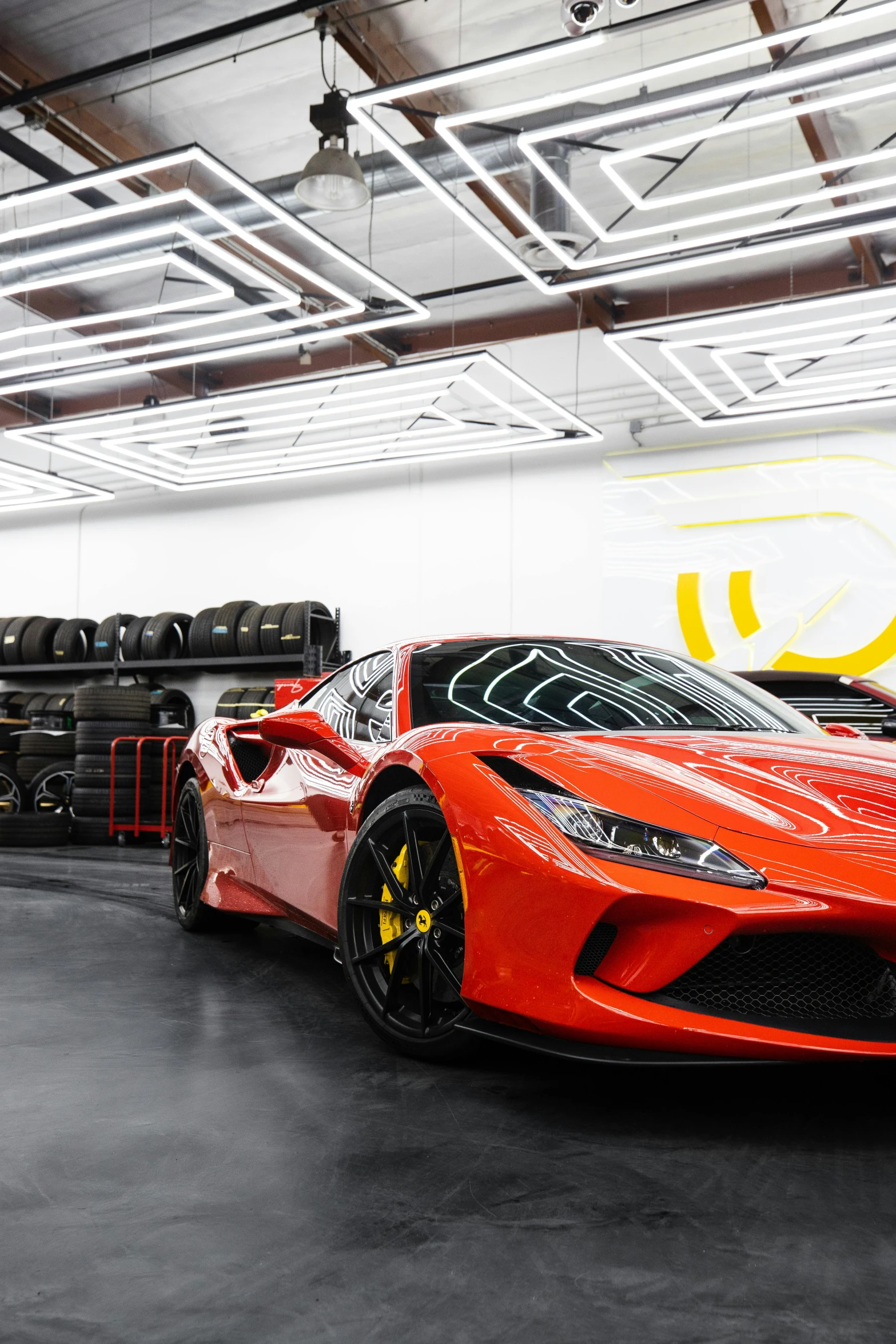 a red sports car parked in a garage, inspired by Bernardo Cavallino, pexels contest winner, renaissance, bay area, 8 k wide shot, glossy and drippy, ferrari logo on it's chest