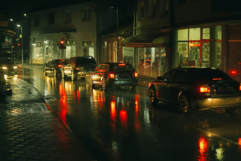 a city street filled with lots of traffic at night, inspired by Elsa Bleda, unsplash contest winner, hyperrealism, rainy; 90's photograph, scandinavian, busy small town street, cinematic 8k