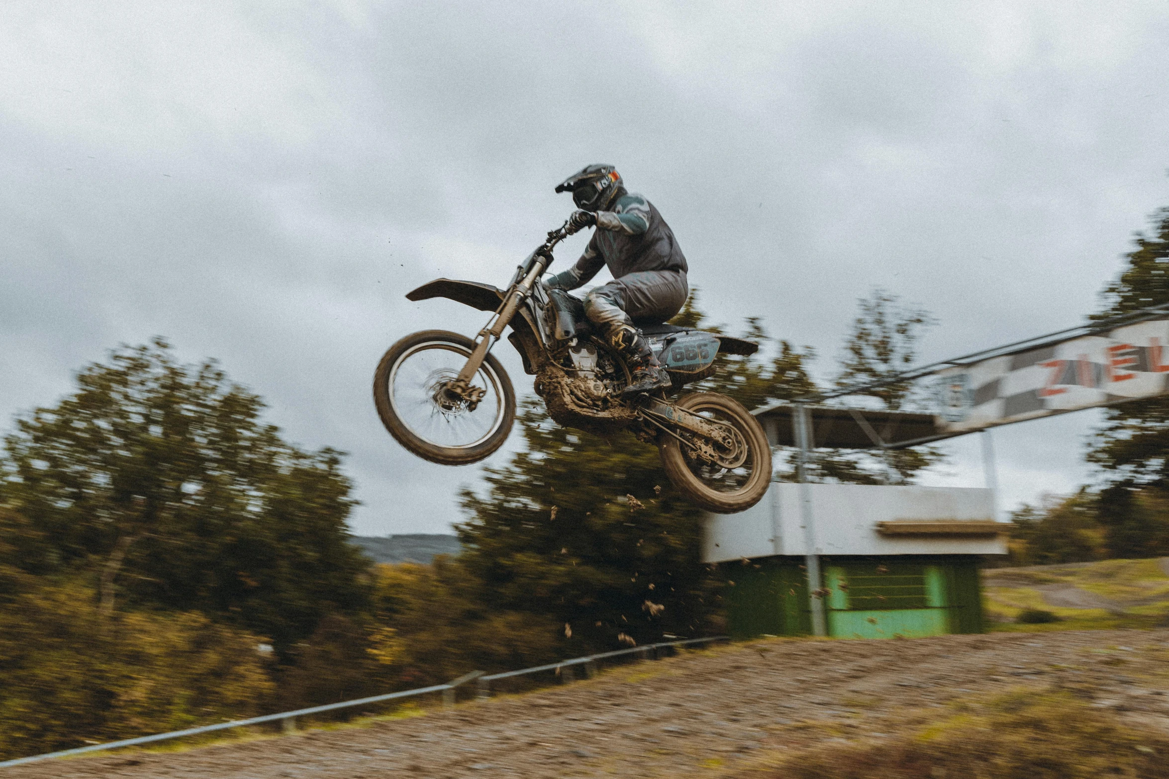 a man flying through the air while riding a dirt bike, pexels contest winner, 👰 🏇 ❌ 🍃, profile image, cinematic footage, nostalgic 8k