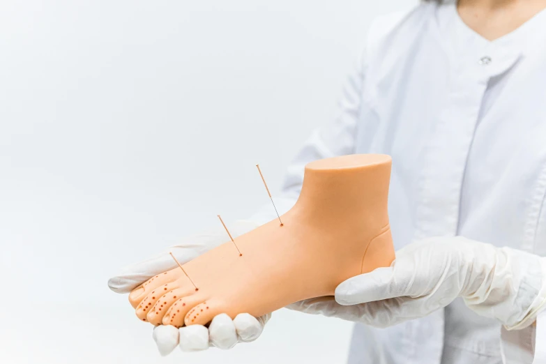 a close up of a person holding a foot, surgical supplies, professional model, thin spikes, best practice