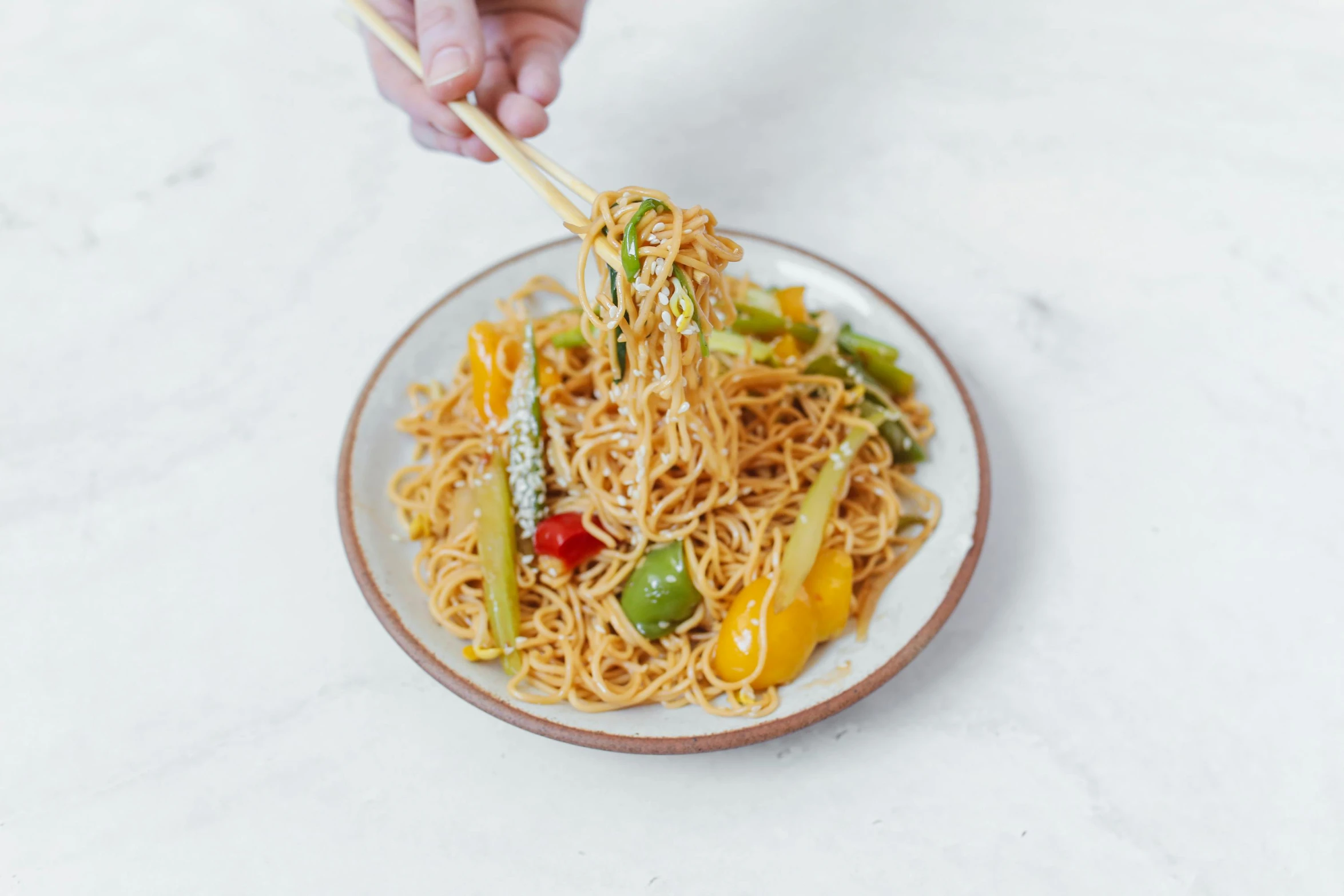 a person holding chopsticks over a plate of noodles, extra crisp image, square, très détaillé, fan favorite