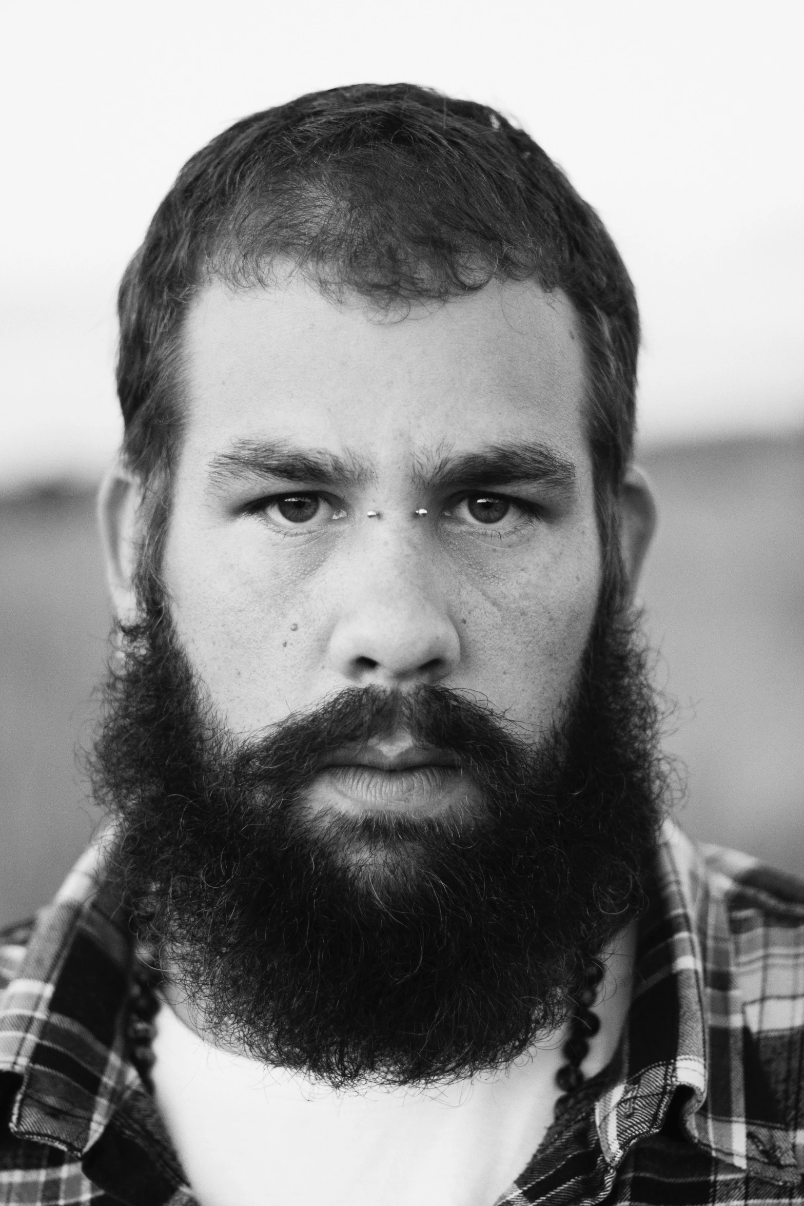 black and white pograph of a man with a beard