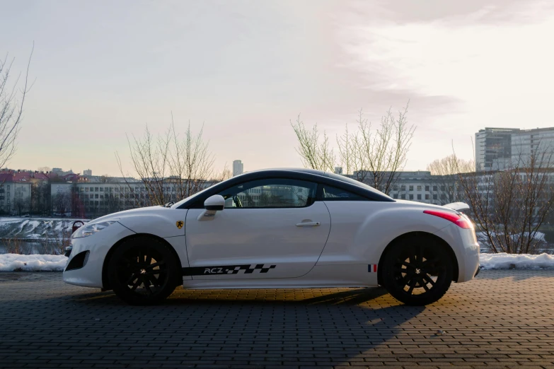 a white car sits in the middle of the ground