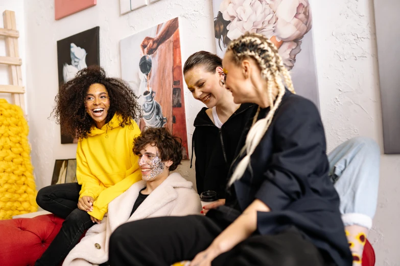 a group of women sitting on top of a red couch, trending on pexels, arbeitsrat für kunst, face painting, in an art gallery], joyful people in the house, smiling at each other