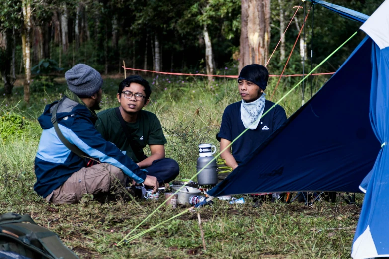 a group of people sitting around a tent, unsplash, sumatraism, avatar image, maintenance photo, scout boy, profile photo