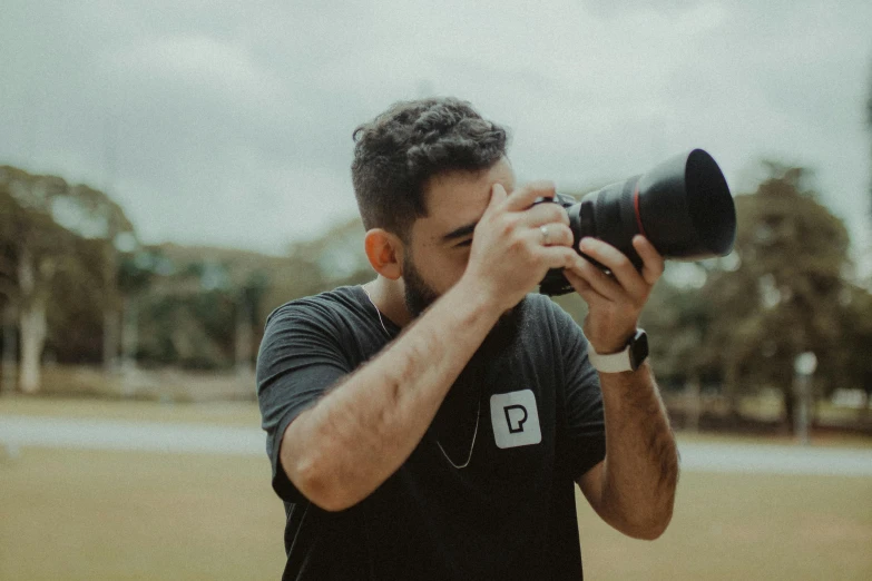 a man taking a picture with a camera, by Robbie Trevino, 4 k cinematic photo, cute photo, cinematic footage, sport photography
