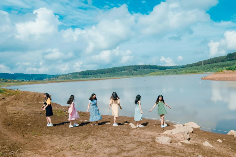 a group of women standing next to a body of water, an album cover, inspired by Scarlett Hooft Graafland, pexels contest winner, hurufiyya, ulzzang, youtube thumbnail, in girls generation, flitting around in the sky