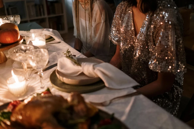 people sit around a long table for a dinner