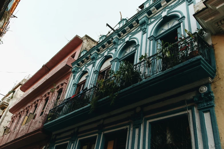 the balcony of a building is made of wood and stone