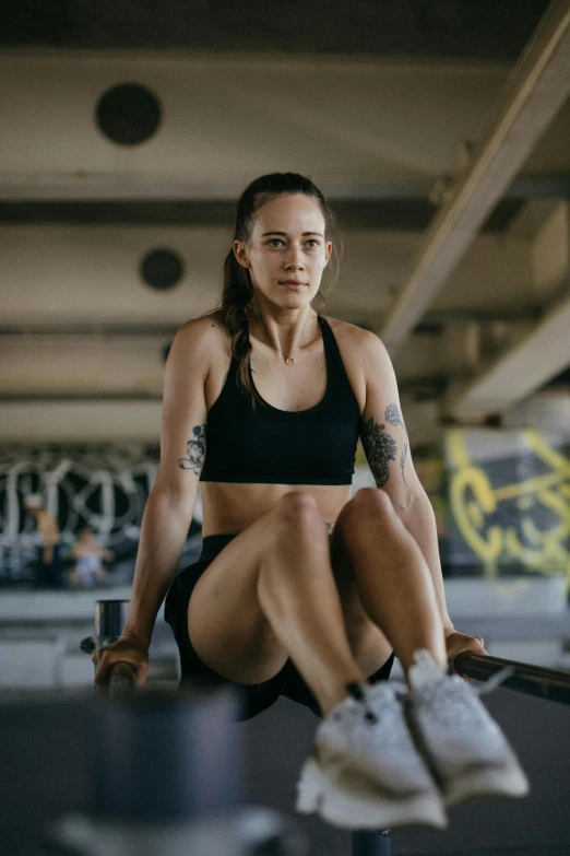 a woman sitting on top of a skateboard