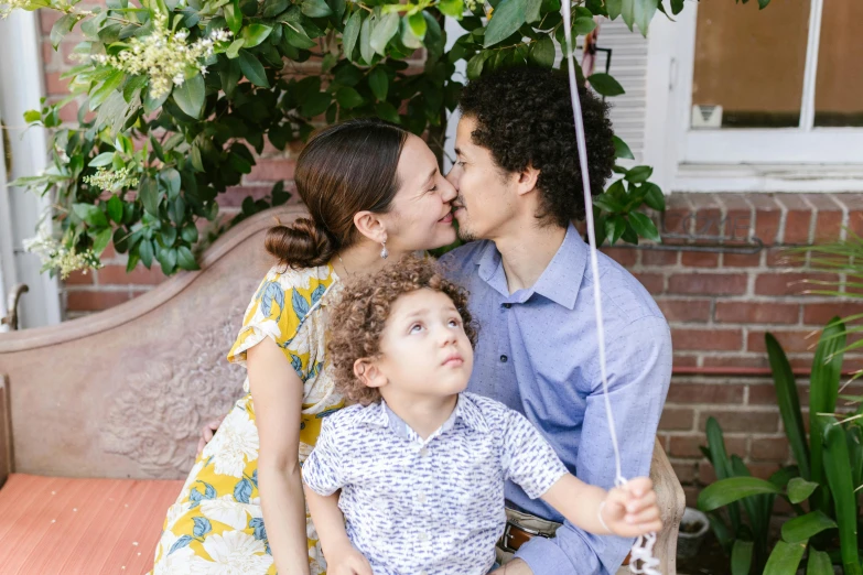 a man and woman sitting on a bench with a child, profile image, kissing, rebecca sugar, portrait image