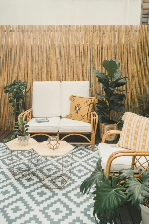 a living room filled with plants and furniture