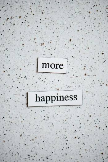 a piece of paper with the words more happiness written on it, by Niko Henrichon, trending on unsplash, made of all white ceramic tiles, half image, wall art, 15081959 21121991 01012000 4k