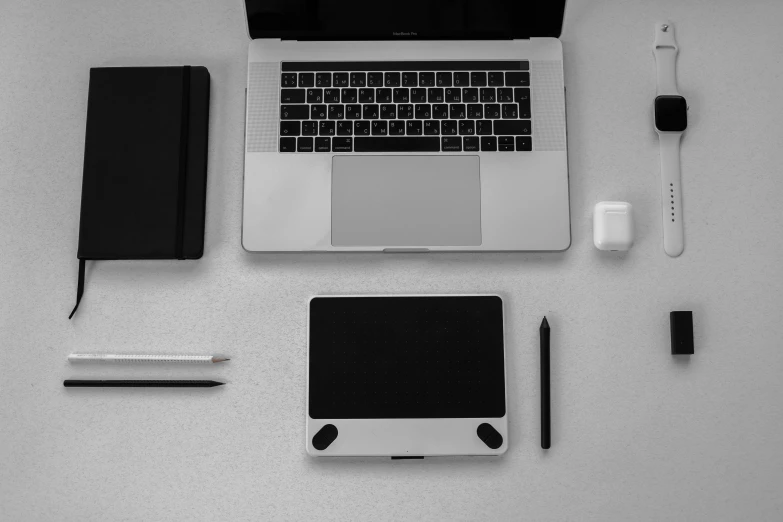 an open laptop computer sitting on top of a table, a computer rendering, pexels, black and white paint, knolling, 9 9 designs, portrait”