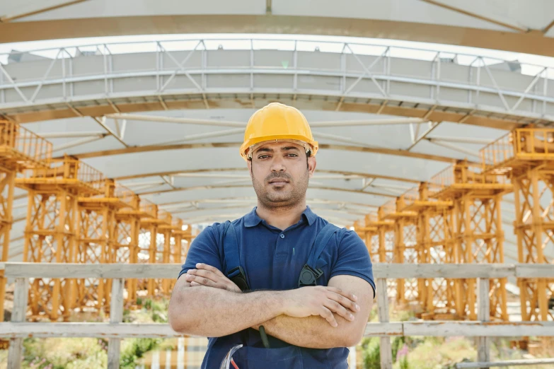 a man wearing a hard hat standing in front of a construction site, a portrait, shutterstock, portrait image, avatar image, riyahd cassiem, very high resolution