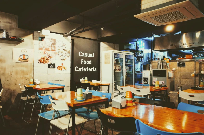 a restaurant with wooden tables and blue chairs, a photo, by Giorgio Cavallon, unsplash, hyperrealism, casual streetwear, cai xukun, 😭 🤮 💕 🎀, food stall