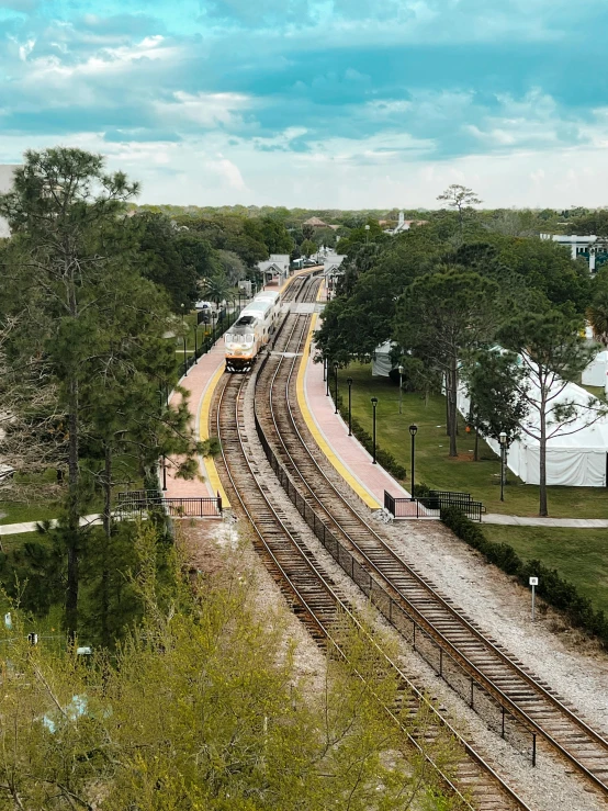 an aerial view of a railroad and track in an urban area