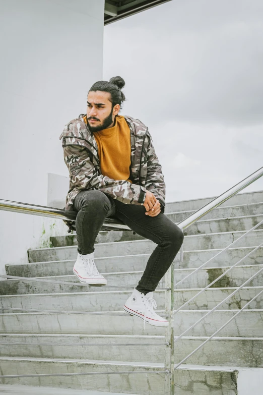 a man flying through the air while riding a skateboard, trending on pexels, singer maluma, wearing camo, contemplating, doing a kickflip over stairs
