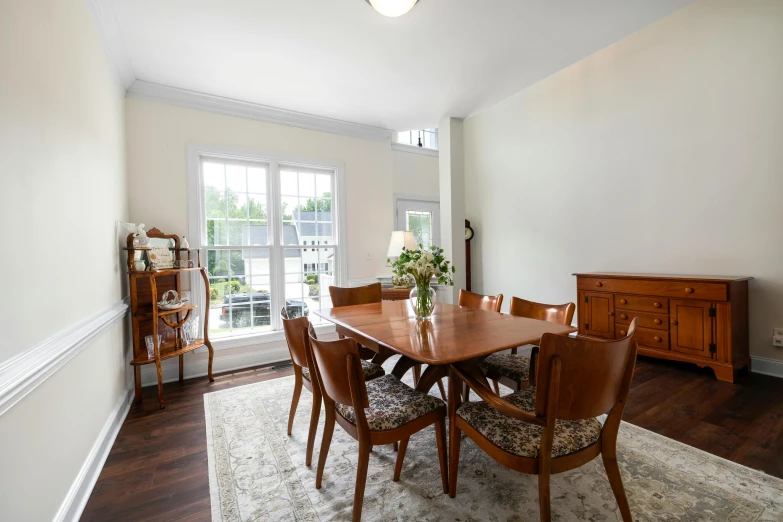 a room that has a wood table and some chairs