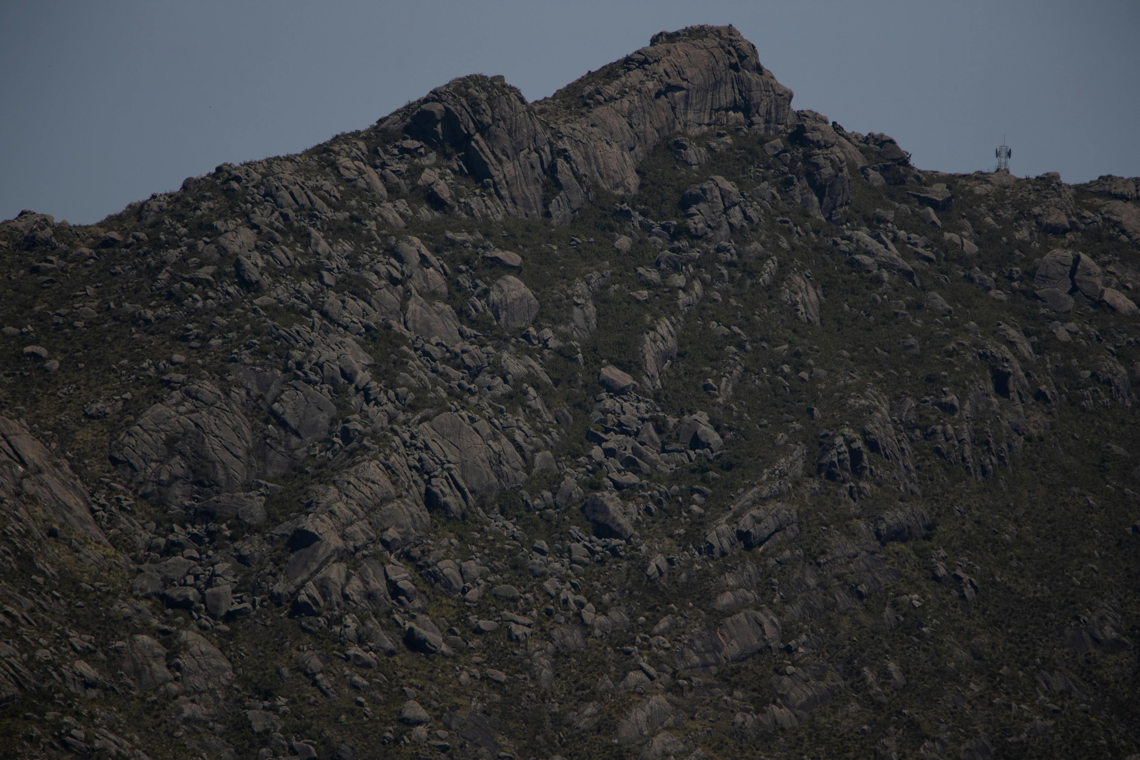 a big mountain with a bird sitting on top