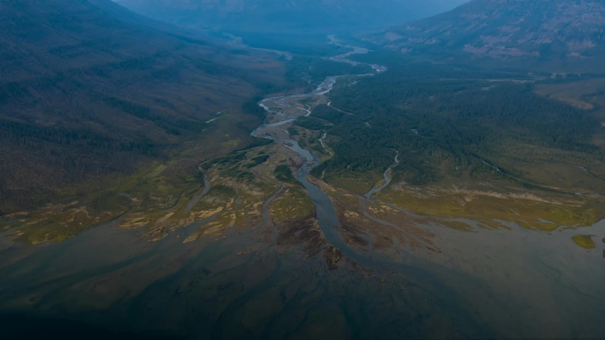 aerial view of large mountain river with flowing streams