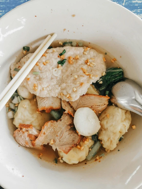 a close up of a bowl of food with chopsticks, bangkuart, a blond, square, stuffed