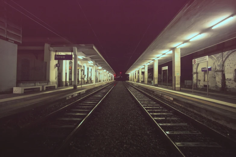a train pulling into a train station at night, unsplash, postminimalism, instagram picture, lomography photo, ilustration, rails