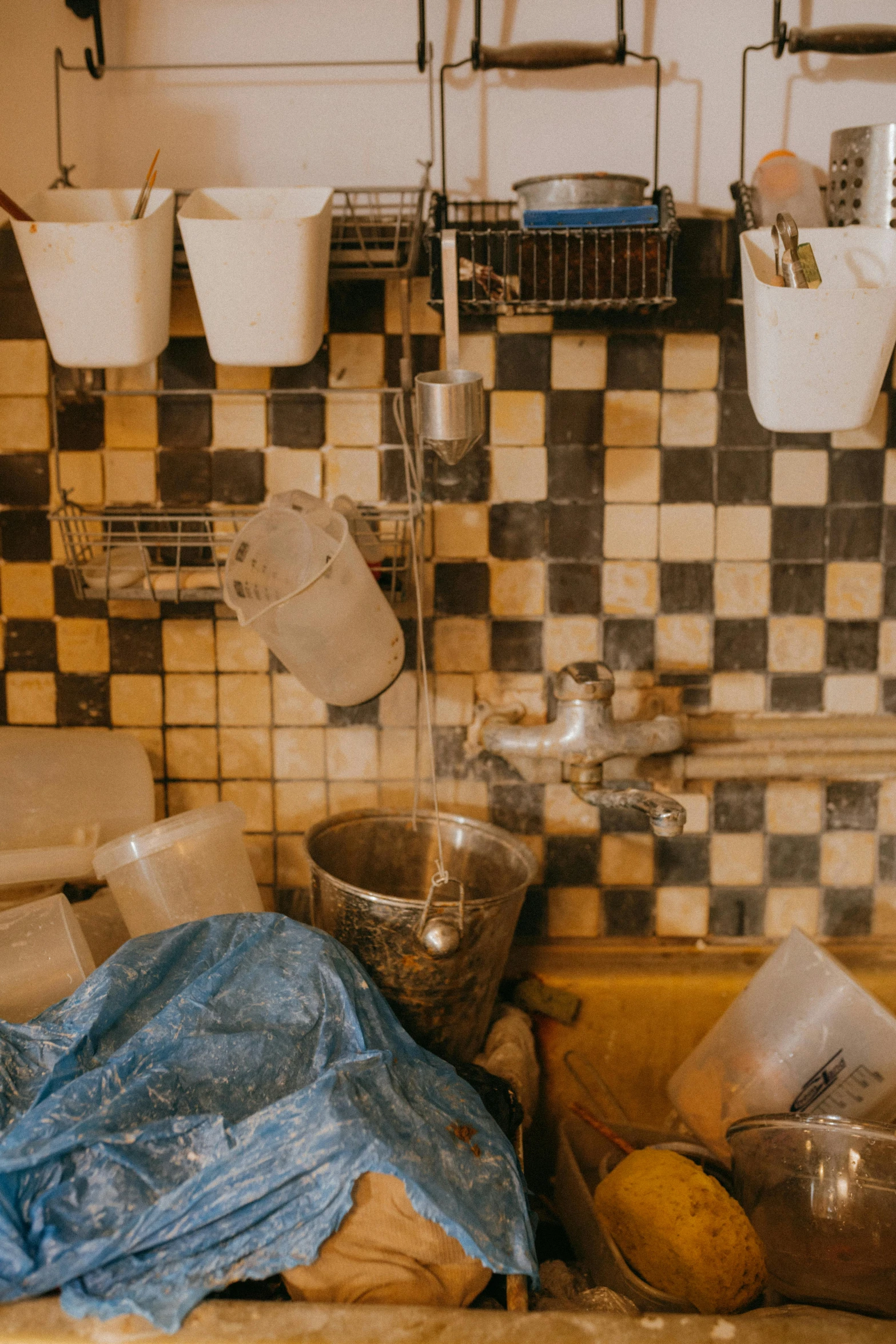 a kitchen sink filled with dirty dishes and utensils, an album cover, by Jan Tengnagel, trending on unsplash, plasticien, in an underground laboratory, tiles, moroccan, low quality photo