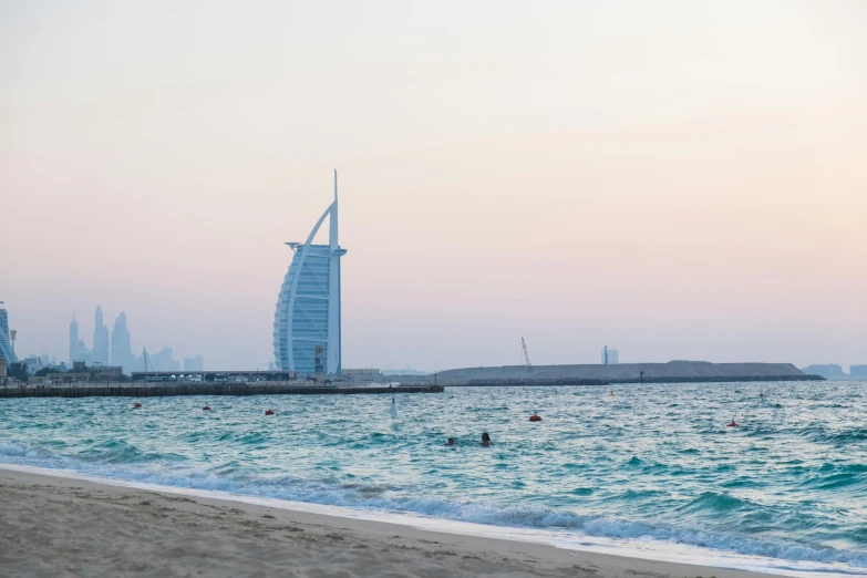 this is a picture of an ocean with a building in the distance