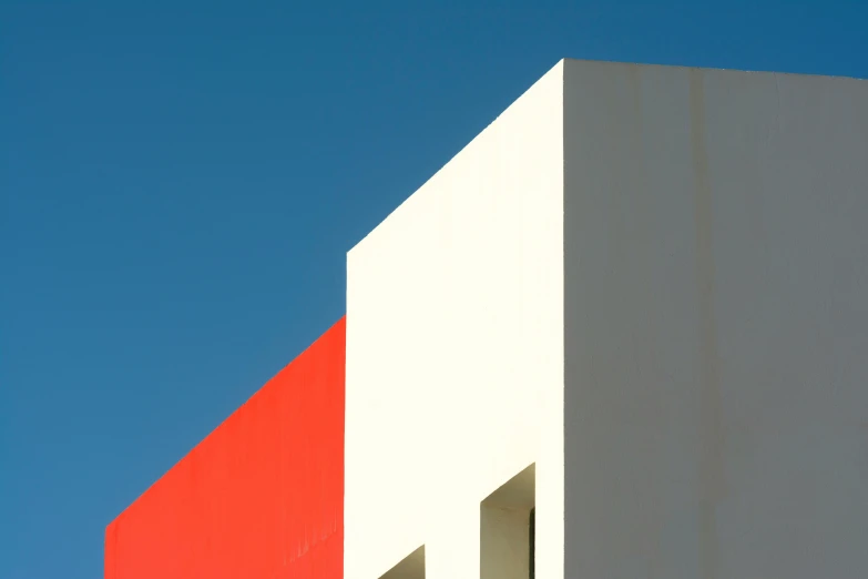 a red and white building against a blue sky, a minimalist painting, inspired by Bauhaus, unsplash, postminimalism, chile, lpoty, front lit, schools