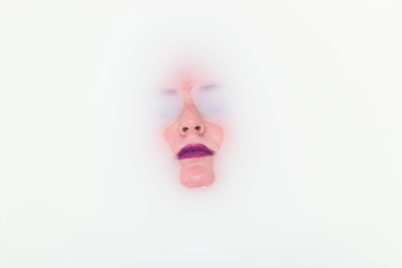 a close up of a person's face on a white surface, inspired by Russell Dongjun Lu, conceptual art, artificial fog, bubblegum body, female floating, detailed face with moustache