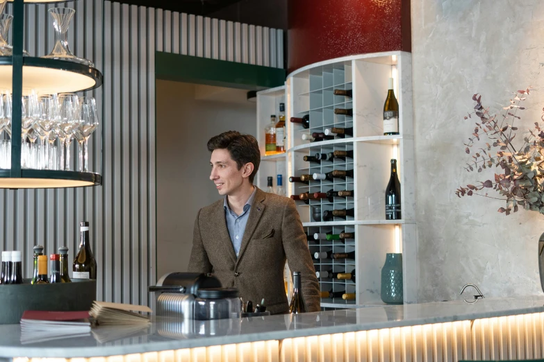 a man that is standing in front of a bar, holding wine bottle, at checkout, guido reni style, lounge