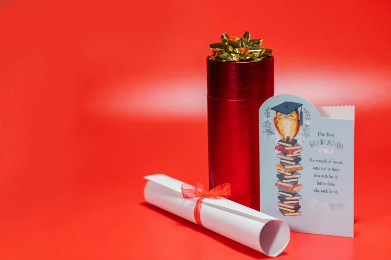 a red vase sitting on top of a red table, pexels contest winner, academic art, discarded scrolls, graduation photo, brightly coloured, tin foiling