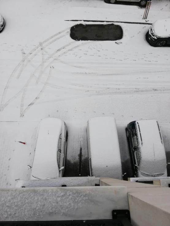 a parking lot full of cars covered in snow, auto-destructive art, seen from straight above, 3/4 view from below, 3 meters, one on each side