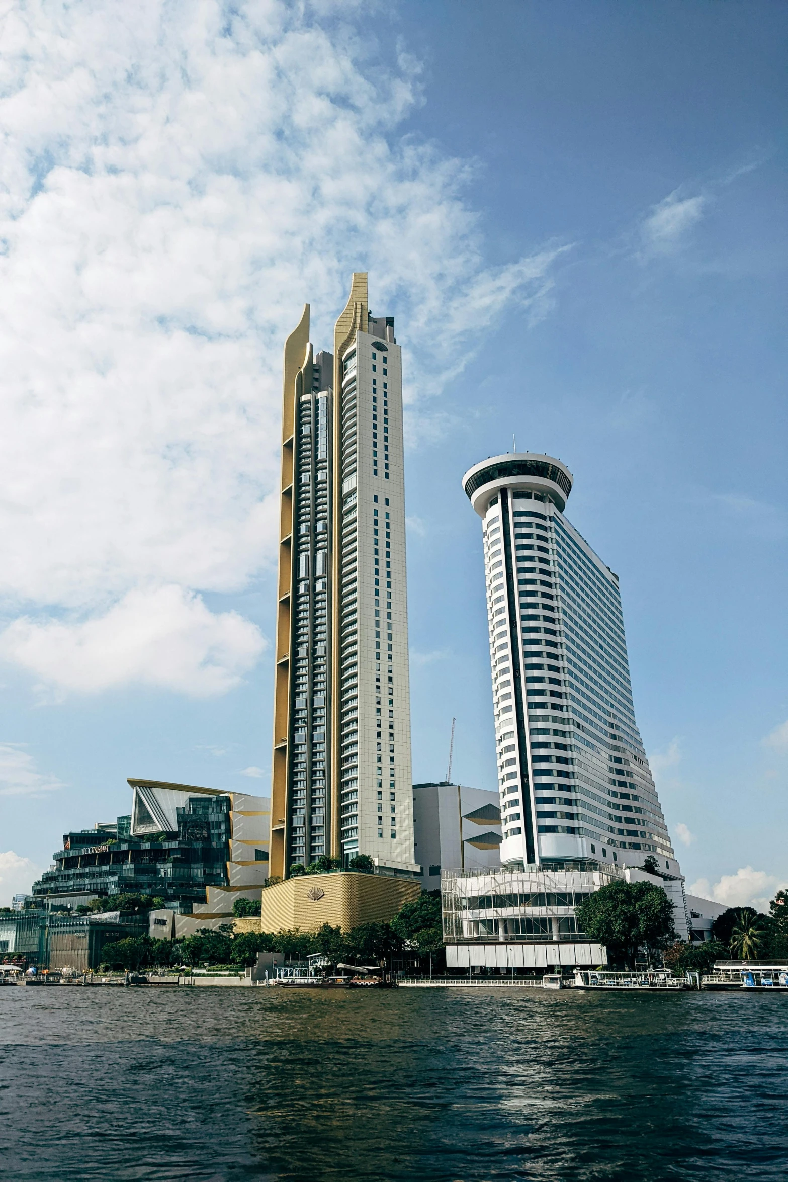 a body of water near buildings on the edge of a city