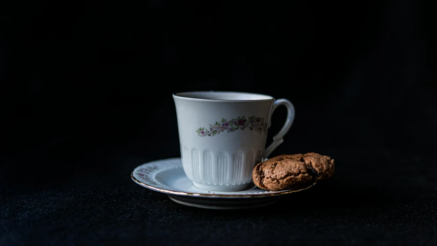 a cup of coffee and a cookie on a saucer, a still life, inspired by Gillis Rombouts, pexels contest winner, portrait of an old, black, 8k 50mm iso 10, small