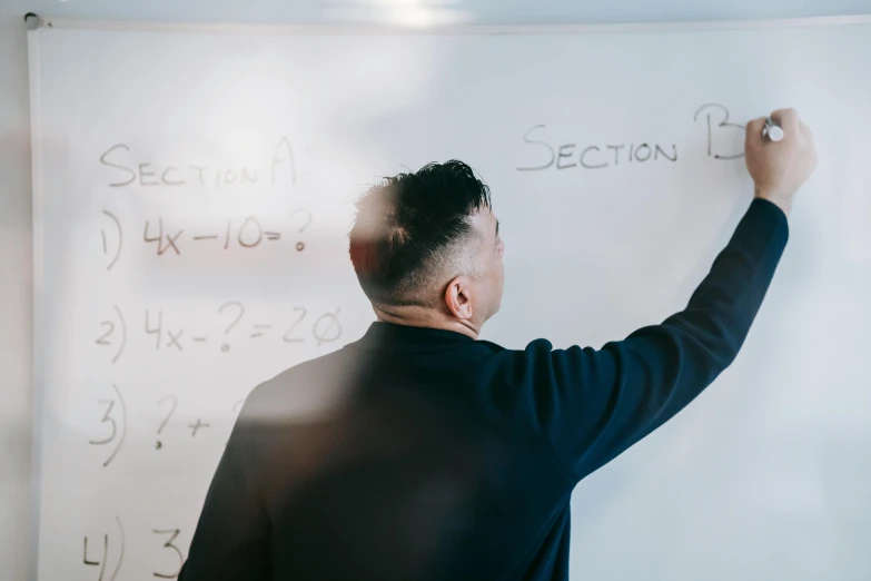 a man is writing on a white board, trending on unsplash, academic art, algebra, lee madgwick & liam wong, te pae, thumbnail