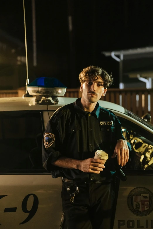 police officer eating ice cream by the car