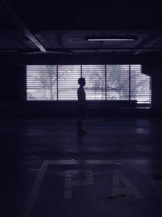 a person standing in an empty parking garage, inspired by Gregory Crewdson, unsplash contest winner, vhs effect, ( ( theatrical ) ), light over boy, ryoji