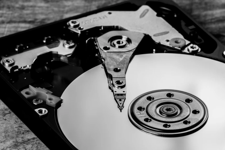 a black and white photo of a hard drive, by Kristian Zahrtmann, pixabay, computer art, a wooden, metal plate photograph, a portrait of @hypnos_onc, high detail product photo